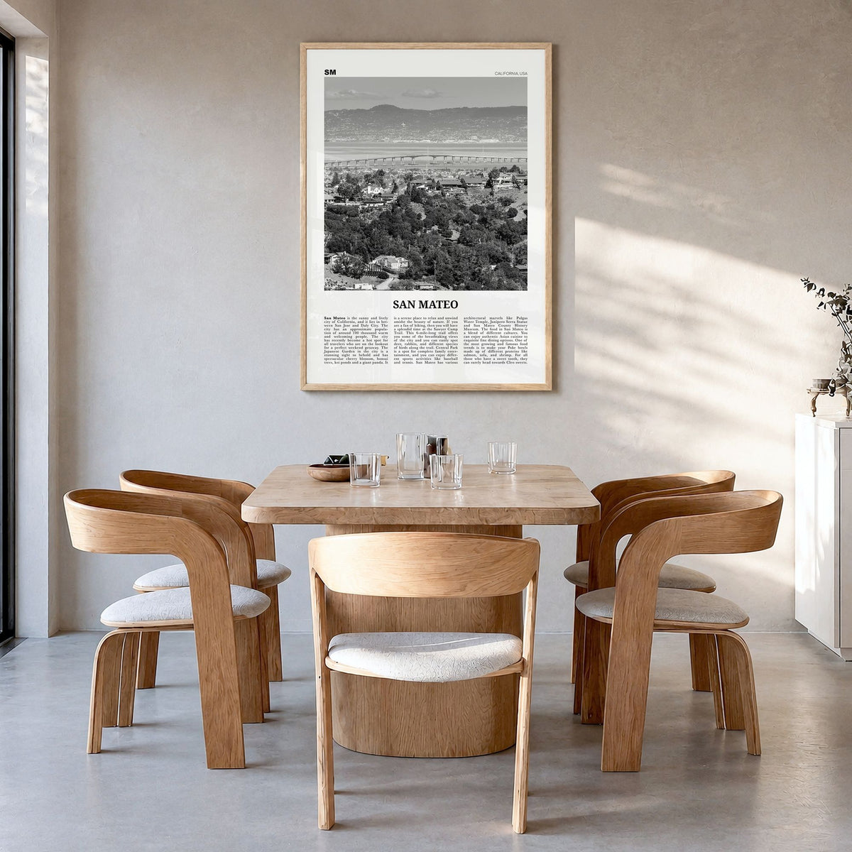 San Mateo Newspaper Poster in a natural wood frame, hanging in a dining room
