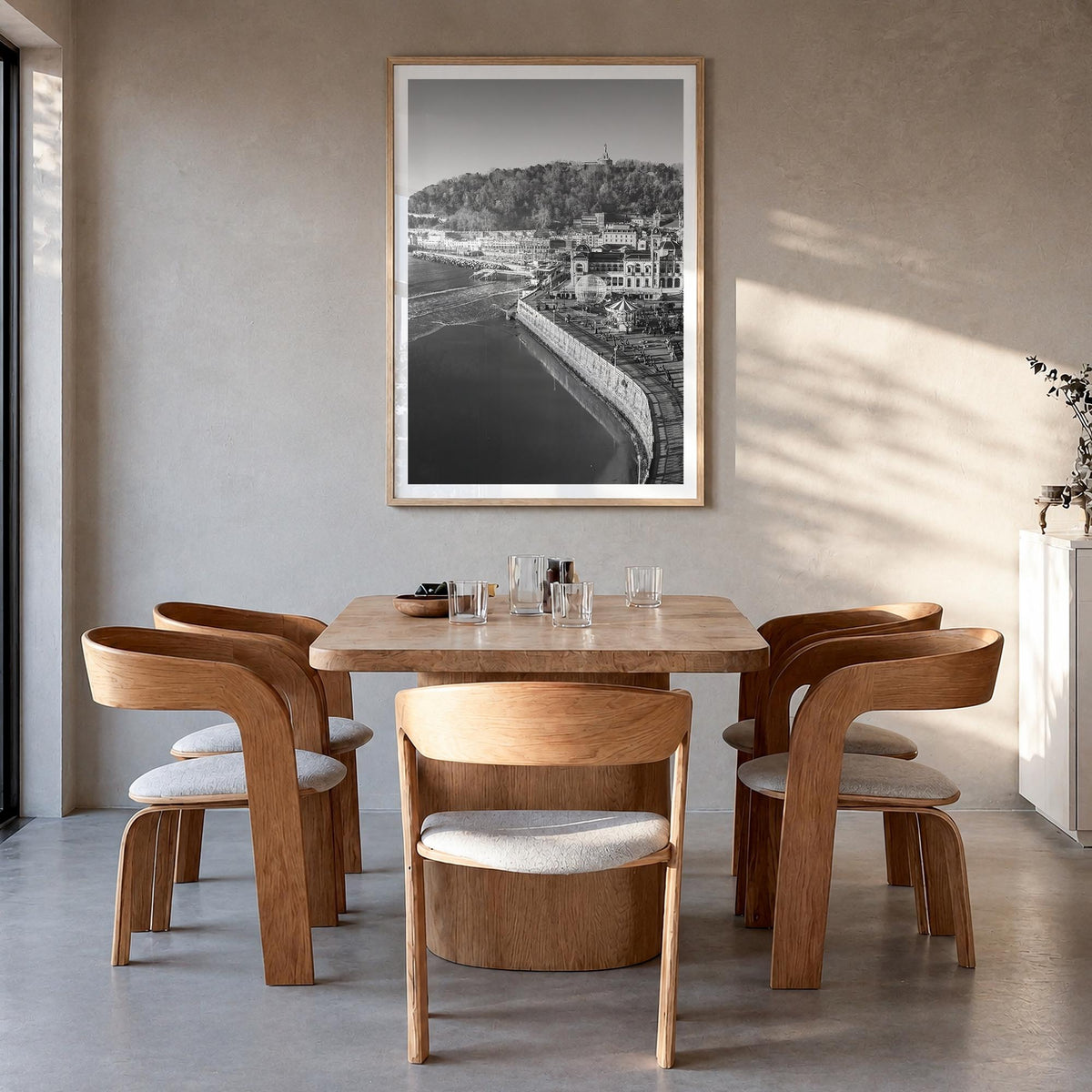 San Sebastián black & white photo poster of Spain – vertical wall art in natural wood frame with white border, hanging on wal