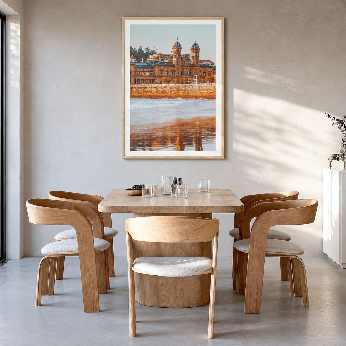 San Sebastián Photo No 2 Poster in a natural wood frame, hanging in a dining room, white border