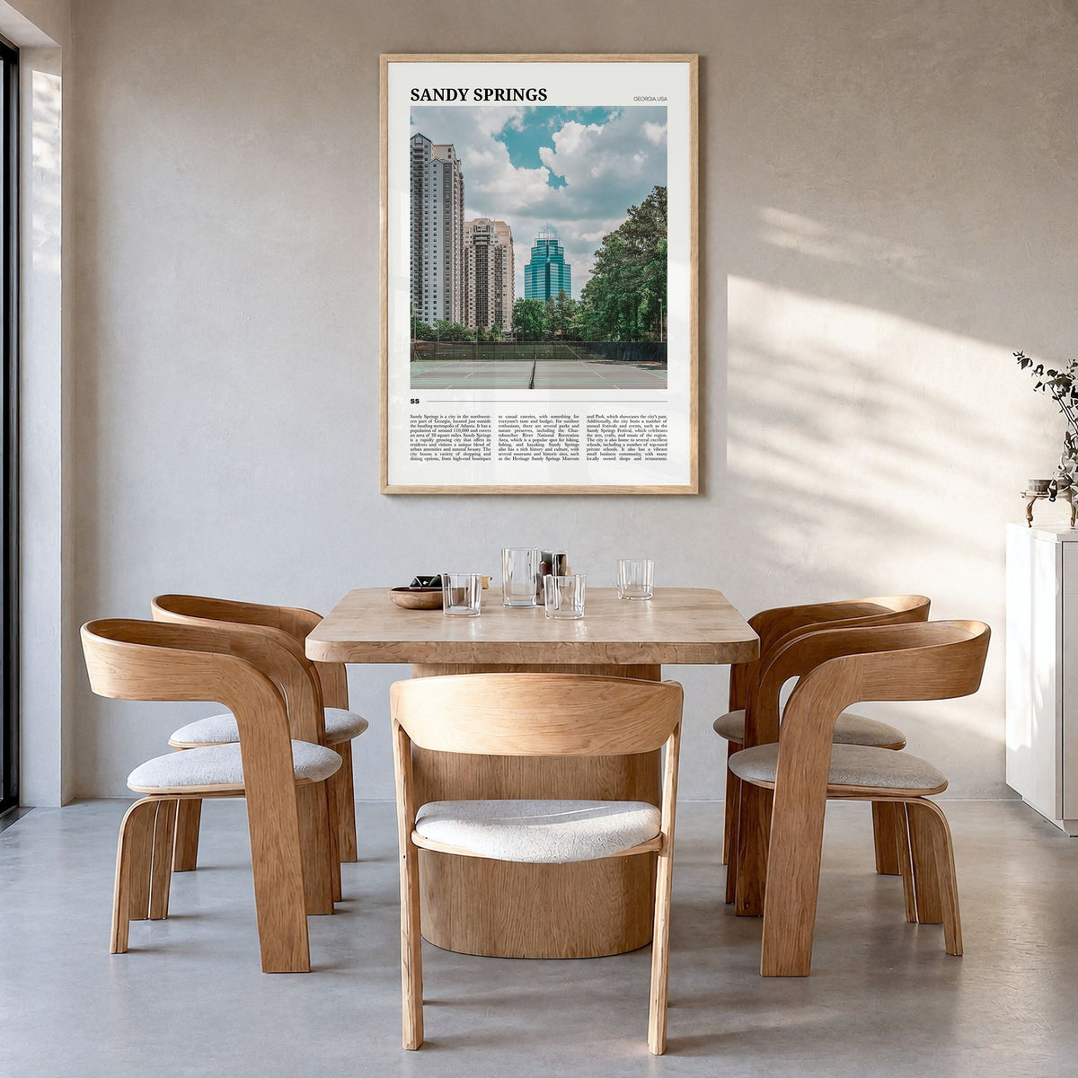 Sandy Springs Travel Poster in a natural wood frame, hanging in a dining room