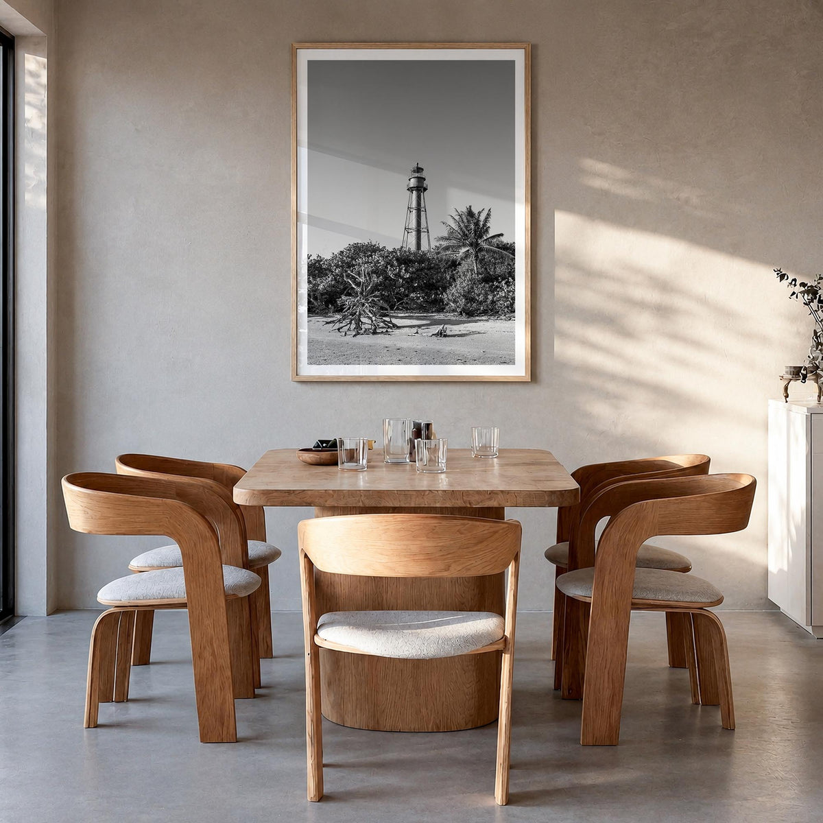 Sanibel black & white photo poster of Florida, USA – vertical wall art in natural wood frame with white border, hanging on wa