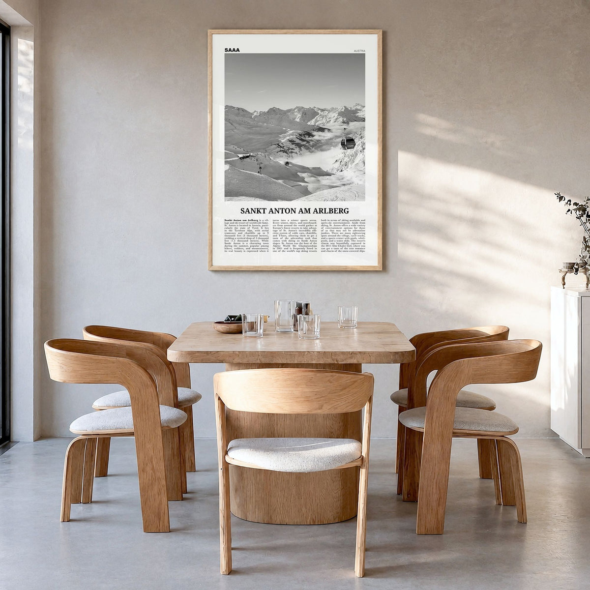 Sankt Anton am Arlberg Newspaper Poster in a natural wood frame, hanging in a dining room