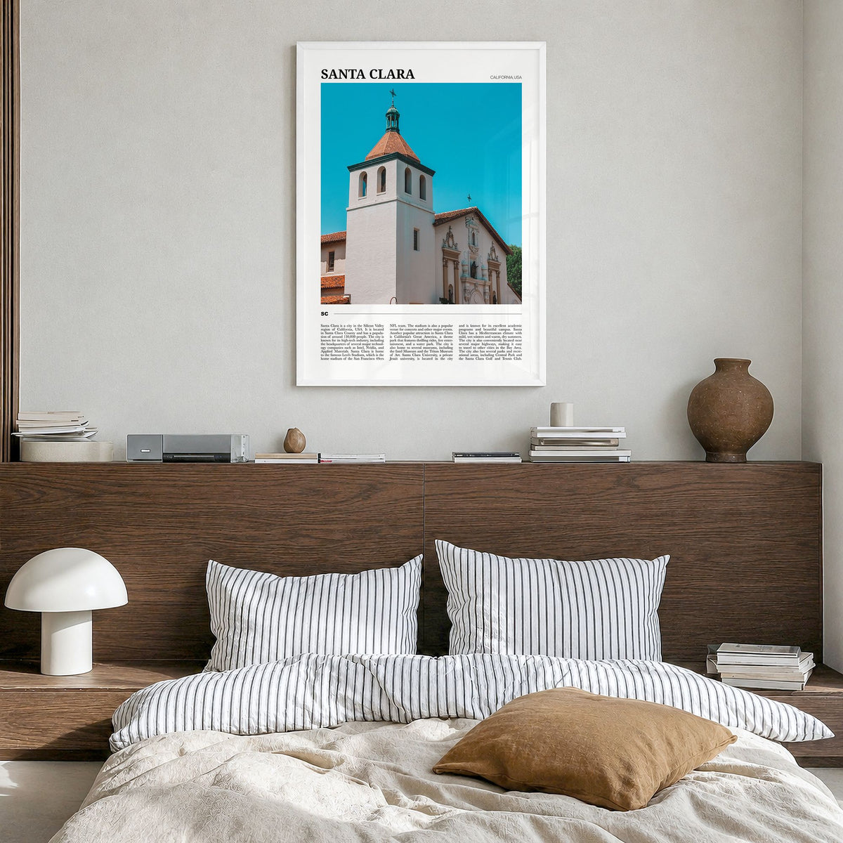 Santa Clara Travel Poster in a white wood frame, hanging in a bedroom