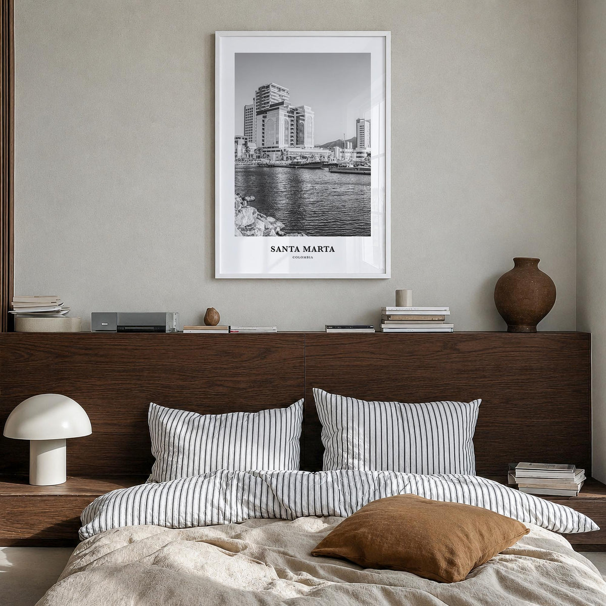 Santa Marta black & white classic poster of Colombia – vertical wall art in white wood frame, hanging on wall