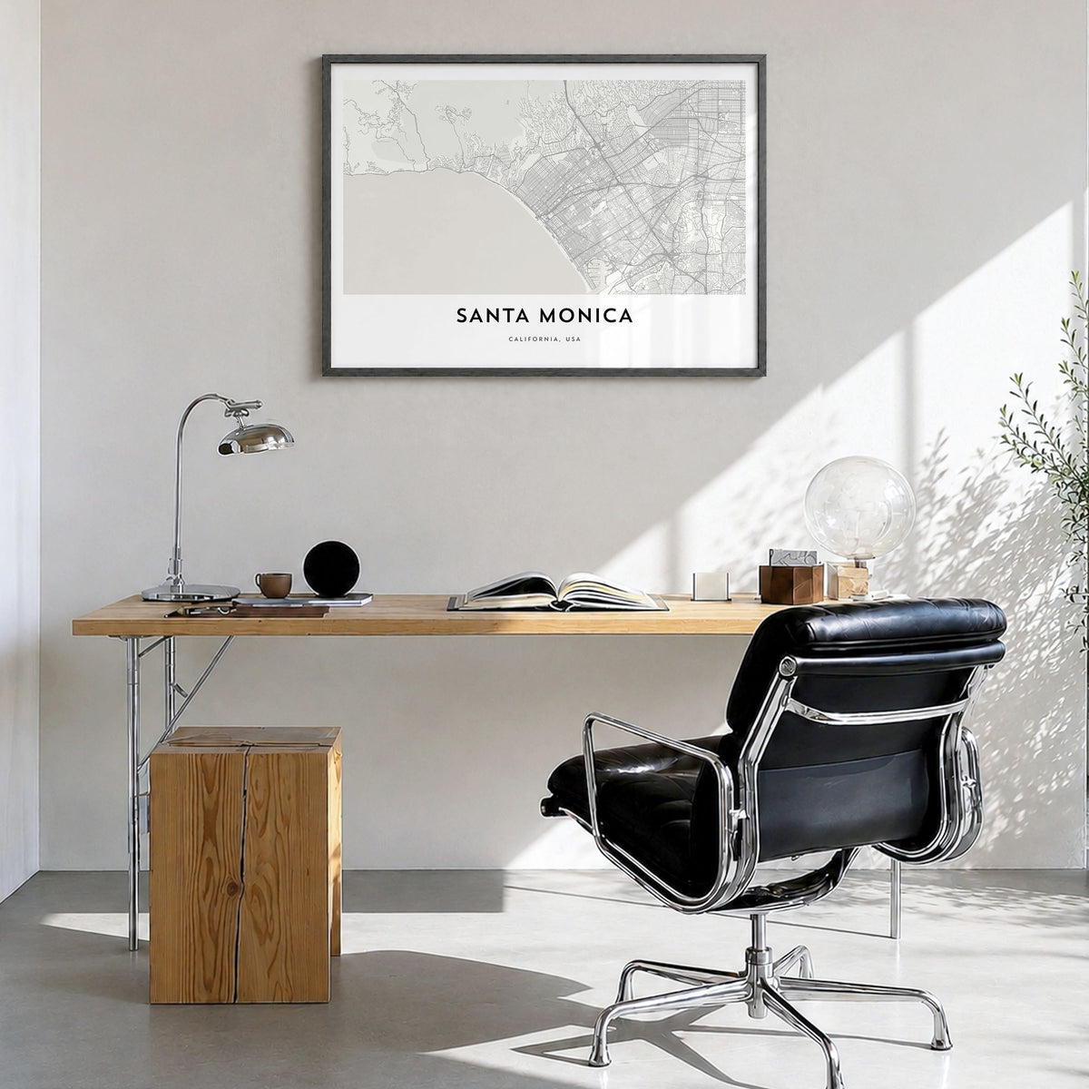 Santa Monica Map Poster in a black wood frame, hanging in a bright home office