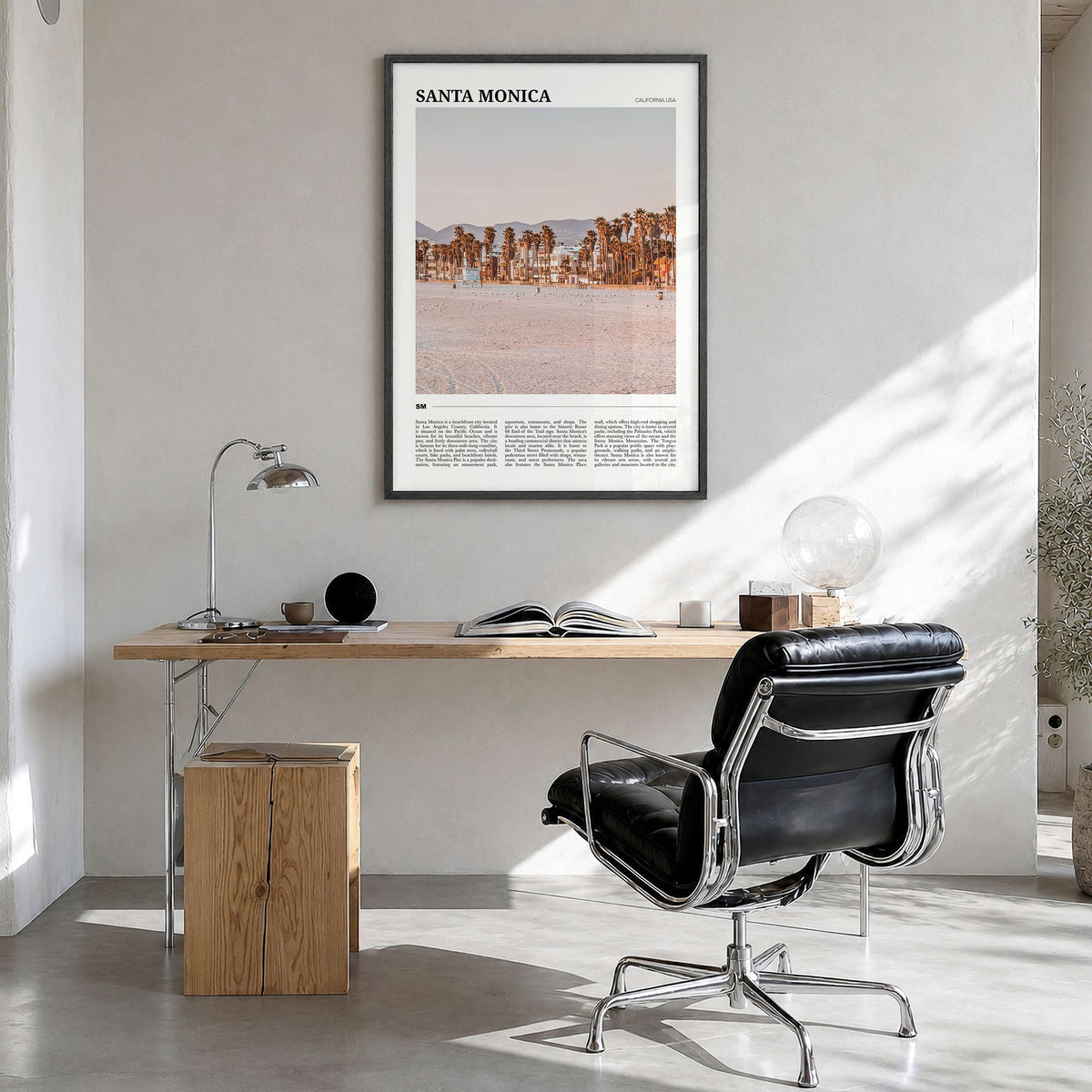 Santa Monica Travel No 1 Poster in a black wood frame, hanging in a bright home office