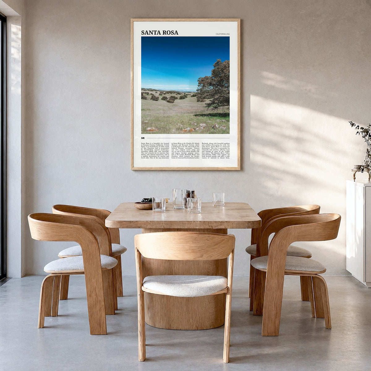 Santa Rosa Travel No 2 Poster in a natural wood frame, hanging in a dining room