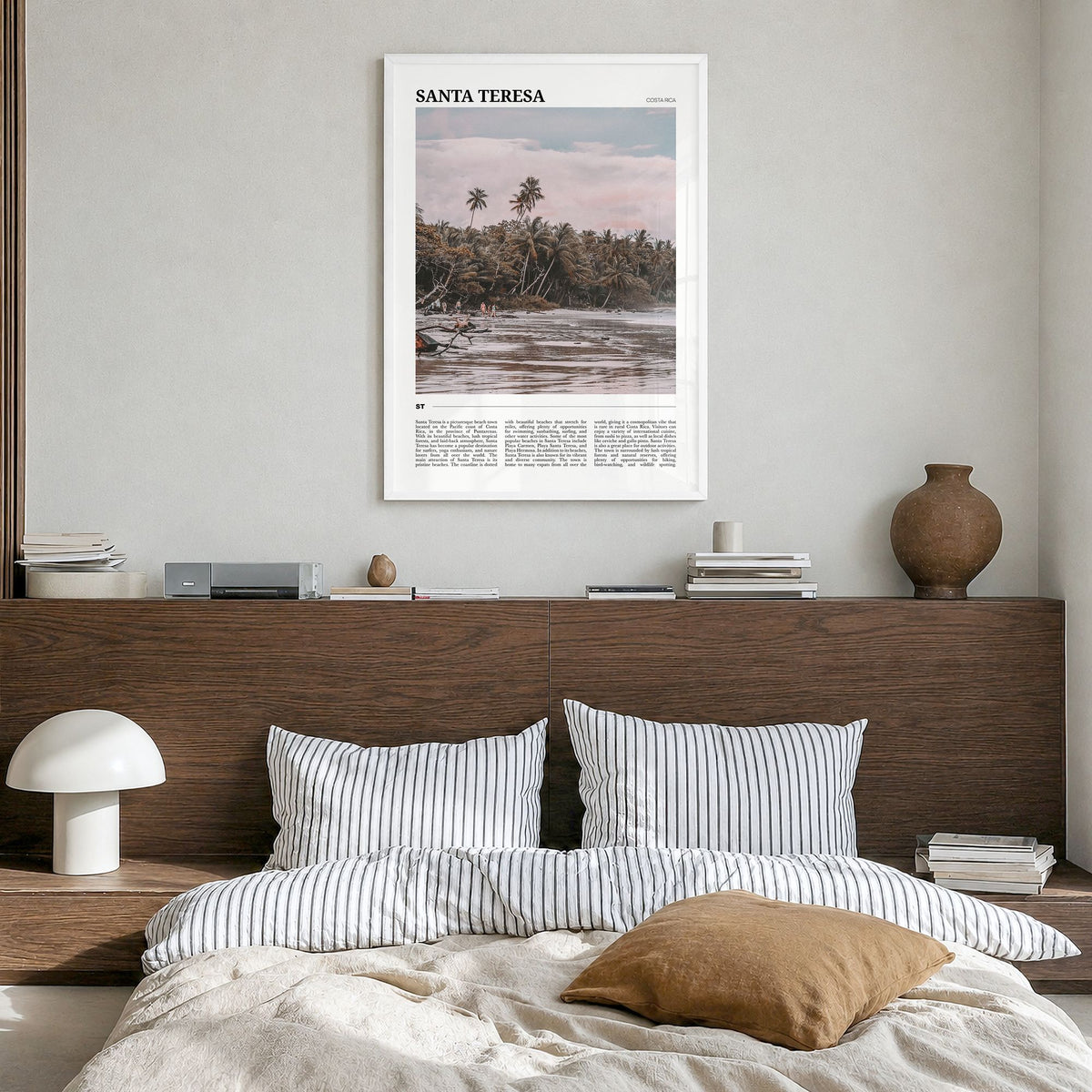 Santa Teresa Travel Poster in a white wood frame, hanging in a bedroom