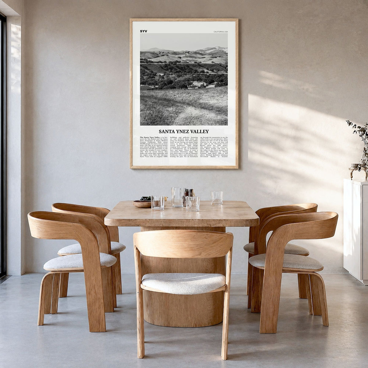 Santa Ynez Valley Newspaper Poster in a natural wood frame, hanging in a dining room