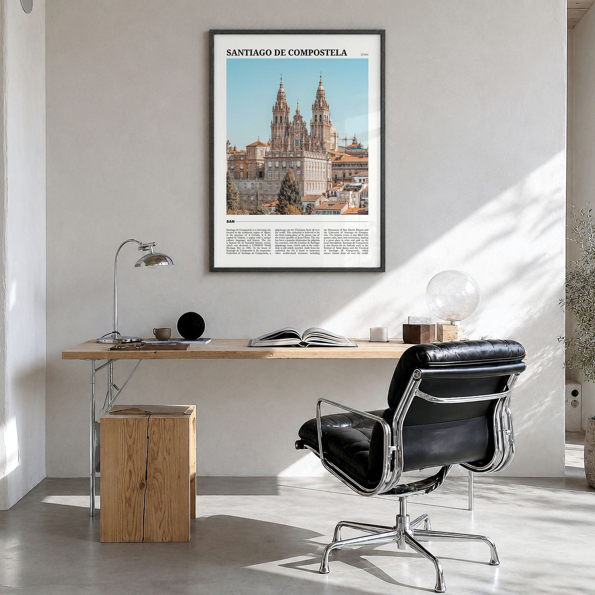 Santiago de Compostela Travel Poster in a black wood frame, hanging in a bright home office