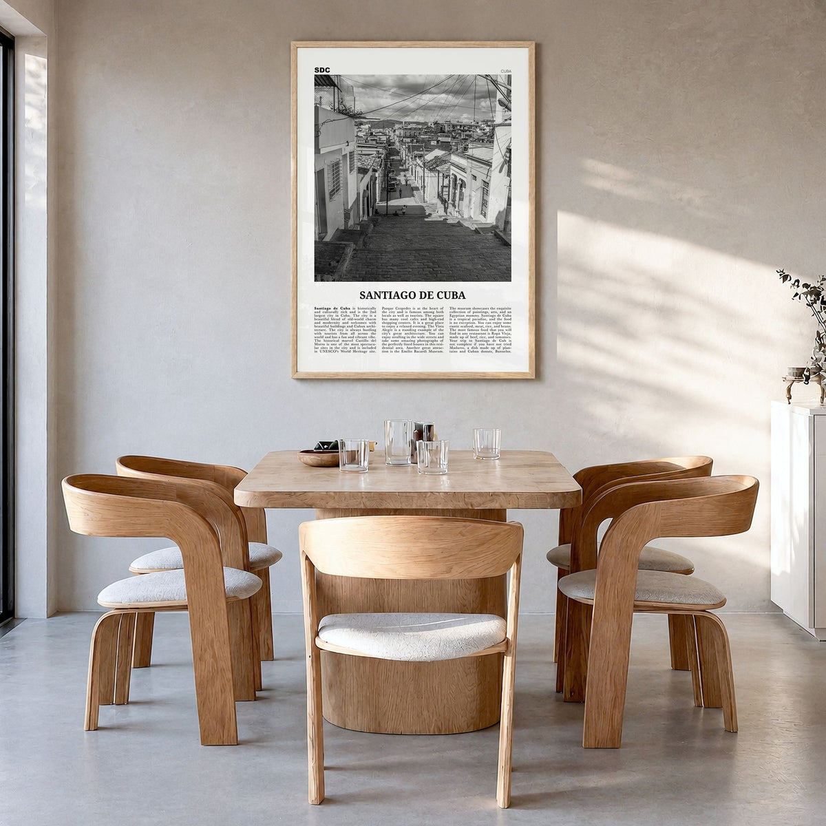 Santiago de Cuba Newspaper Poster in a natural wood frame, hanging in a dining room