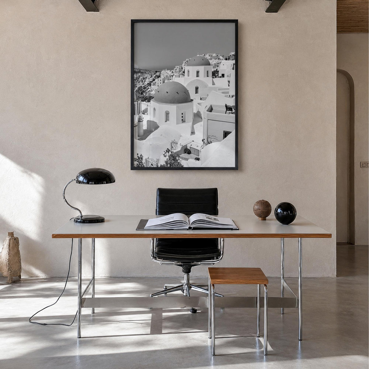 Santorini no. 1 black & white photo poster of Greece – vertical wall art in black wood frame, hanging on wall