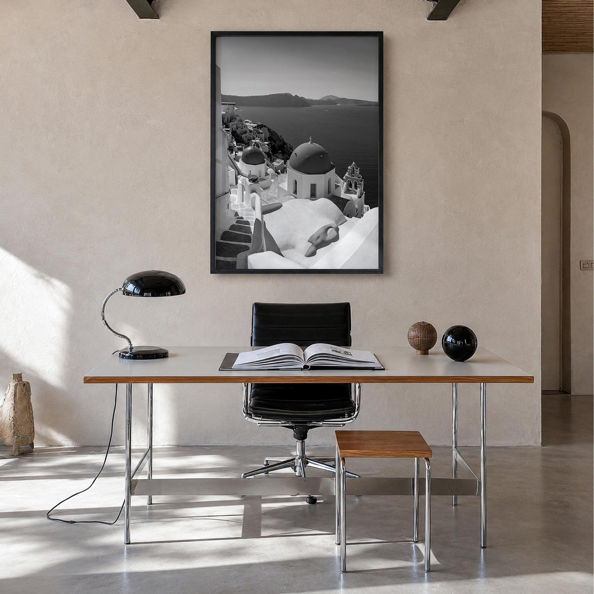Santorini no. 2 black & white photo poster of Greece – vertical wall art in black wood frame, hanging on wall