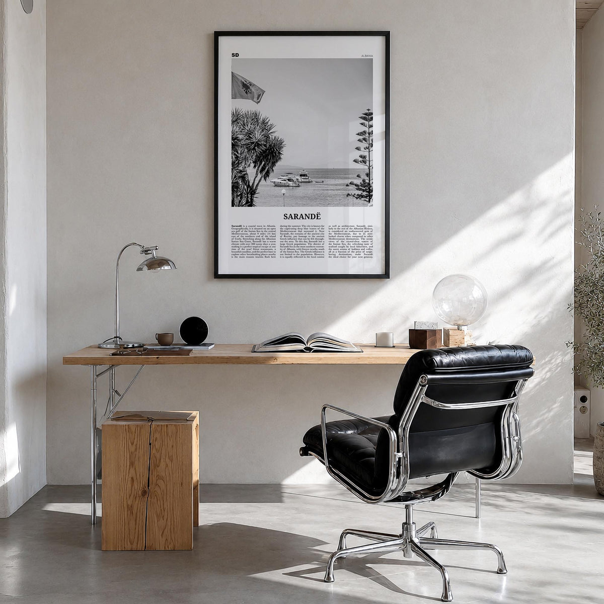 Sarandë black & white newspaper poster of Albania – vertical wall art in black wood frame, hanging on wall