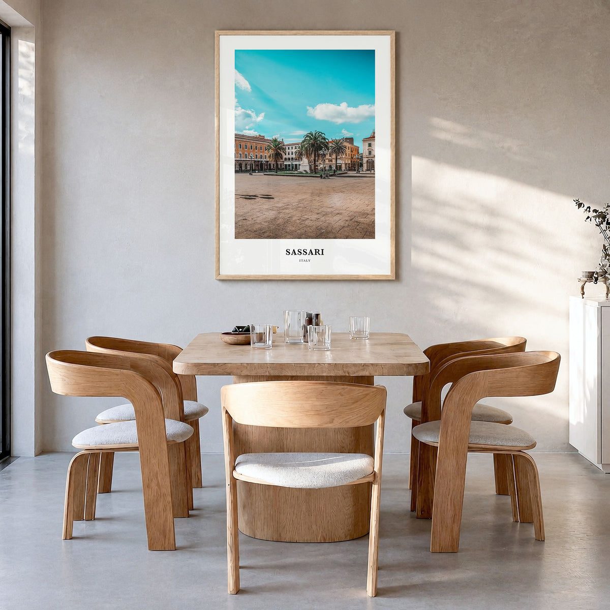 Sassari Classic Poster in a natural wood frame, hanging in a dining room
