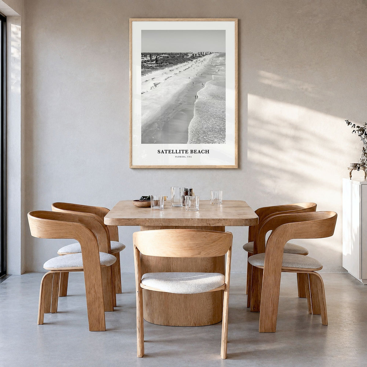 Satellite Beach Classic Poster in a natural wood frame, hanging in a dining room