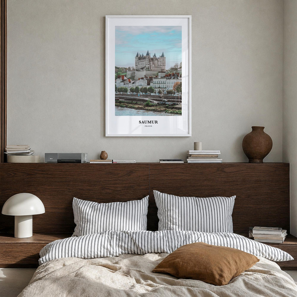 Saumur colorful classic poster of France – vertical wall art in white wood frame, hanging on wall