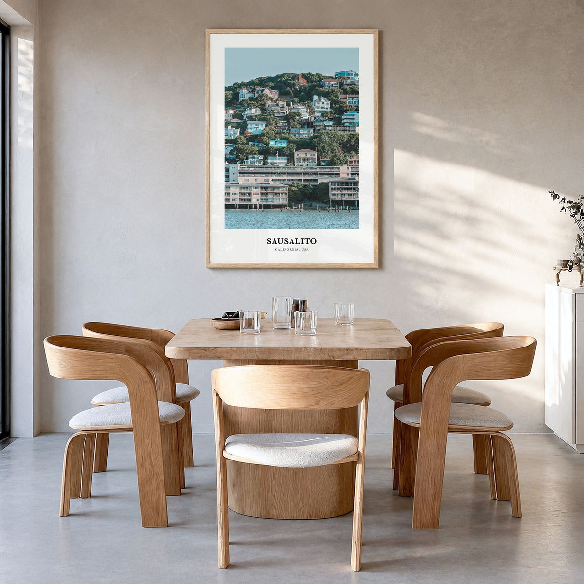 Sausalito Classic Poster in a natural wood frame, hanging in a dining room