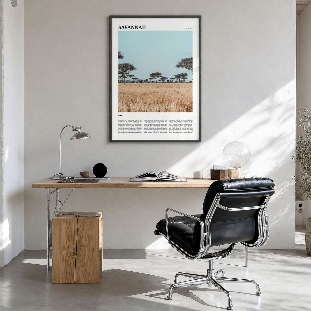 Savannah Travel Poster in a black wood frame, hanging in a bright home office