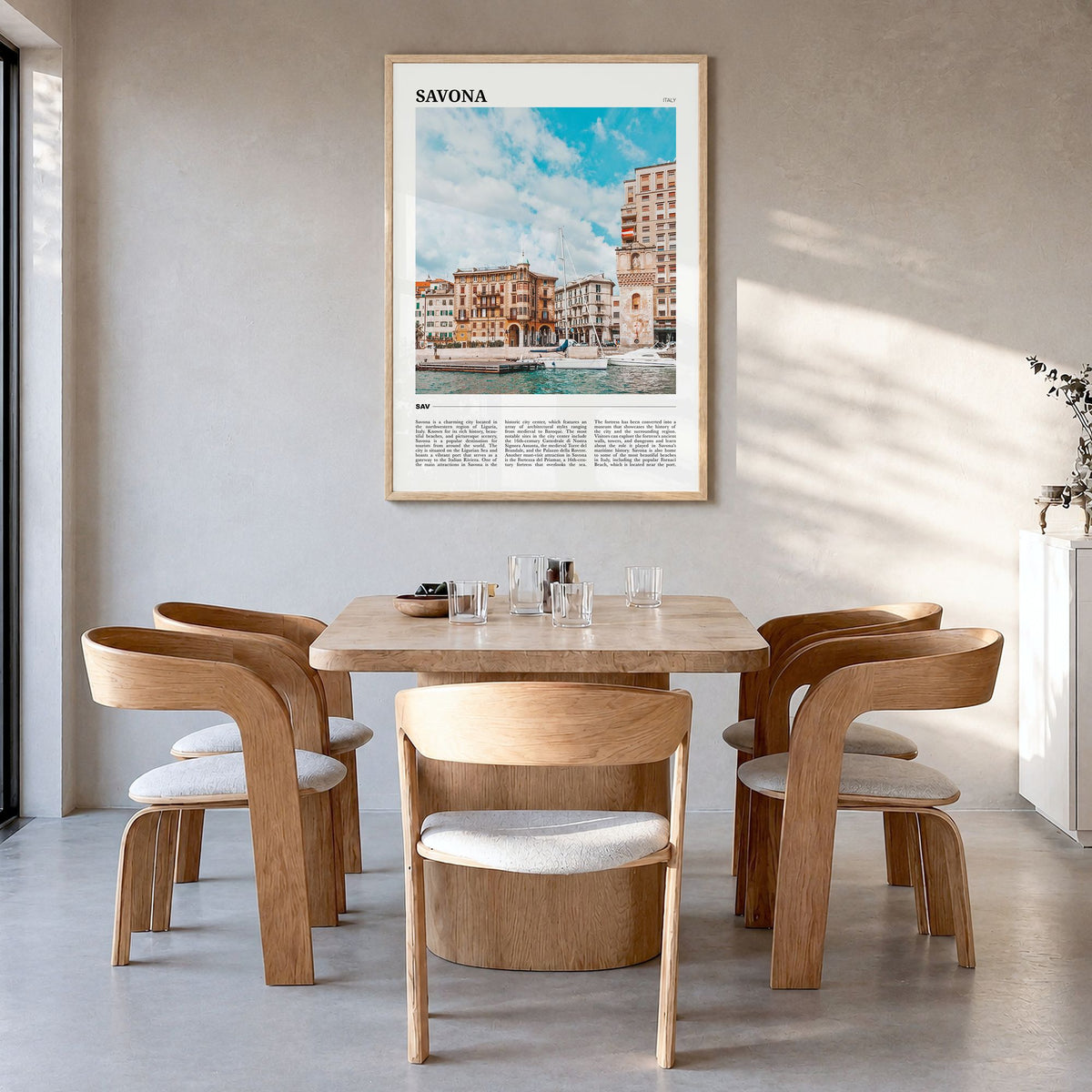 Savona Travel Poster in a natural wood frame, hanging in a dining room