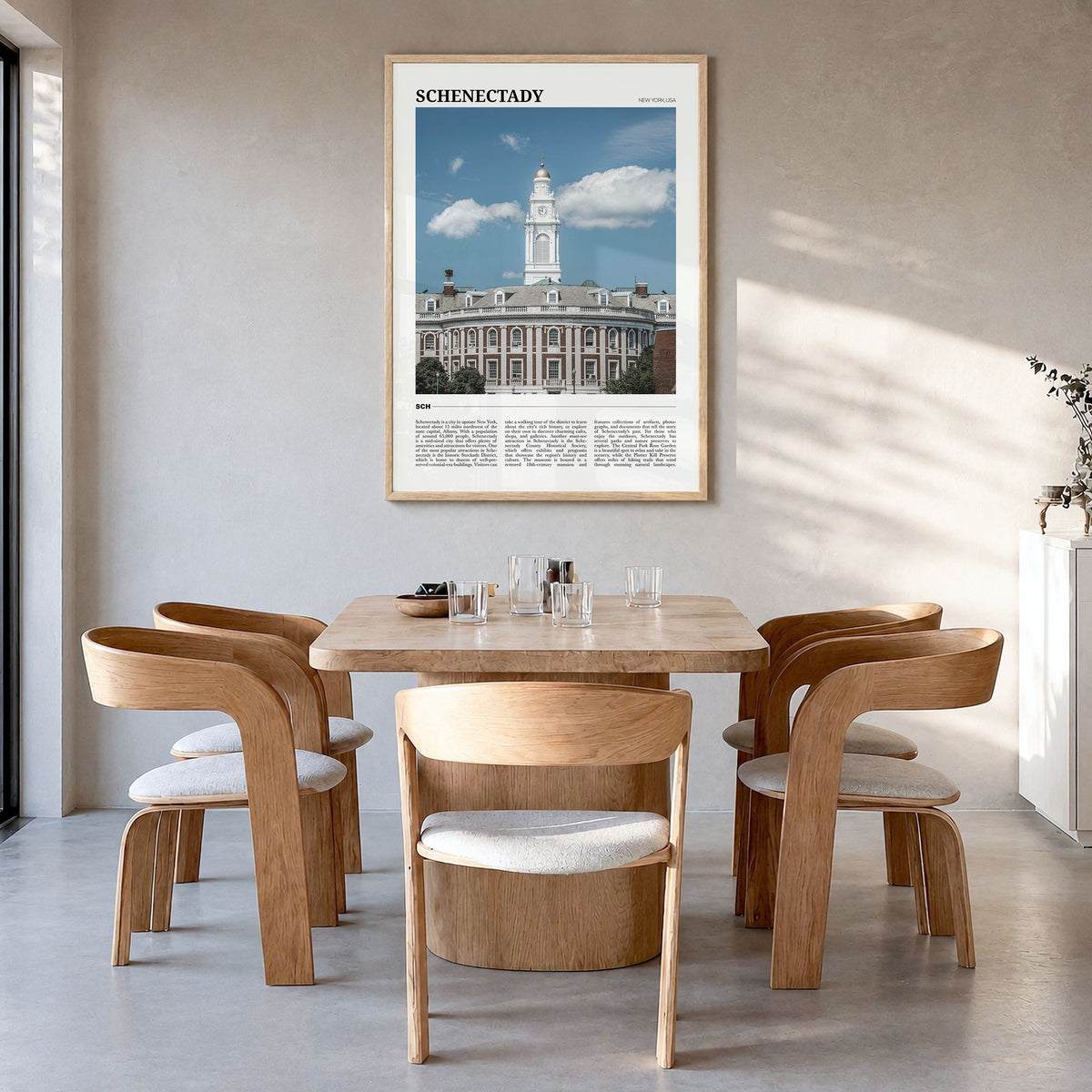 Schenectady Travel Poster in a natural wood frame, hanging in a dining room