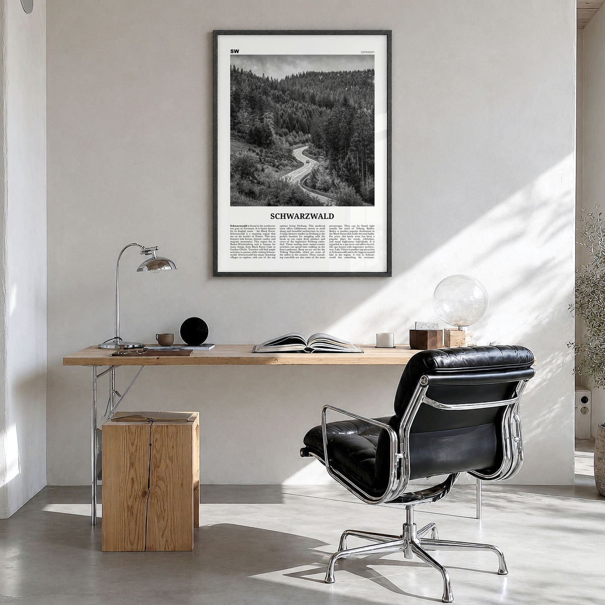 Schwarzwald Newspaper Poster in a black wood frame, hanging in a bright home office