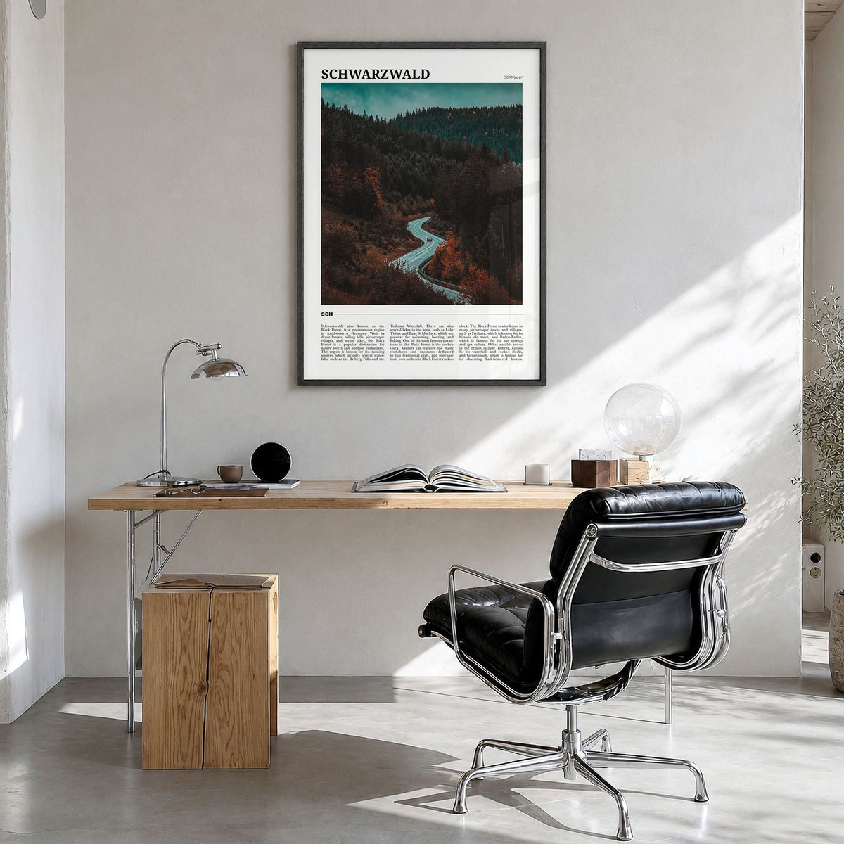 Schwarzwald Travel Poster in a black wood frame, hanging in a bright home office