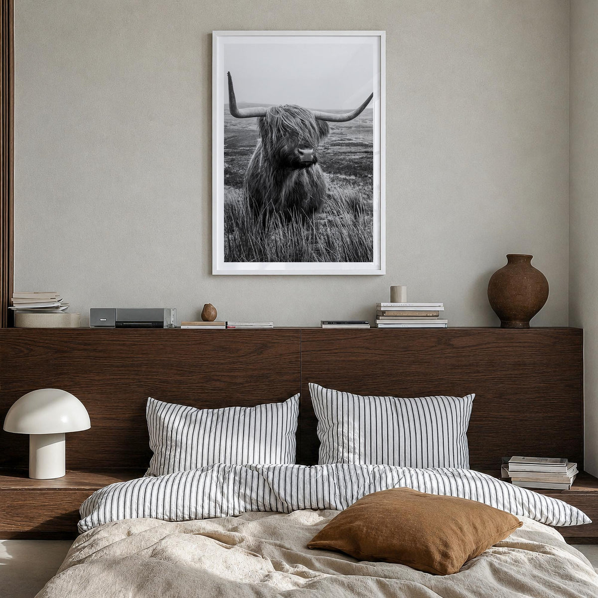 Scottish Highlander no. 1 black & white photo poster – vertical wall art in white wood frame with white border, hanging on wa
