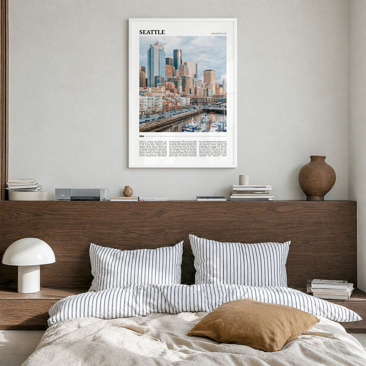 Seattle Travel No 1 Poster in a white wood frame, hanging in a bedroom