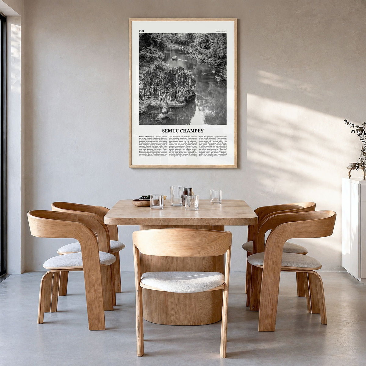 Semuc Champey Newspaper Poster in a natural wood frame, hanging in a dining room