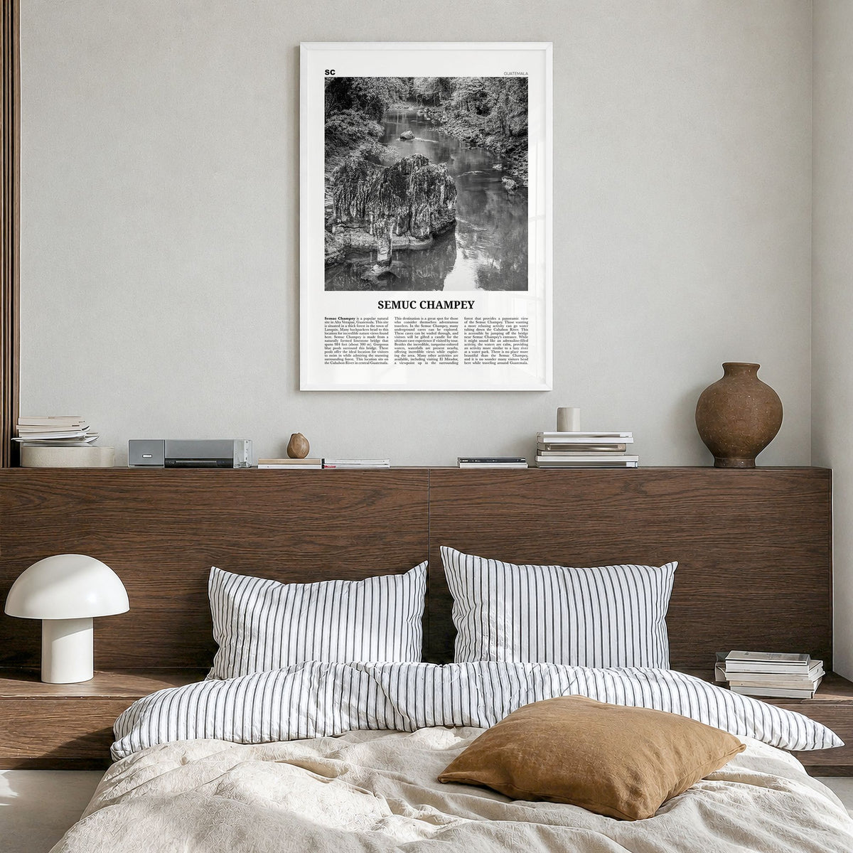 Semuc Champey Newspaper Poster in a white wood frame, hanging in a bedroom