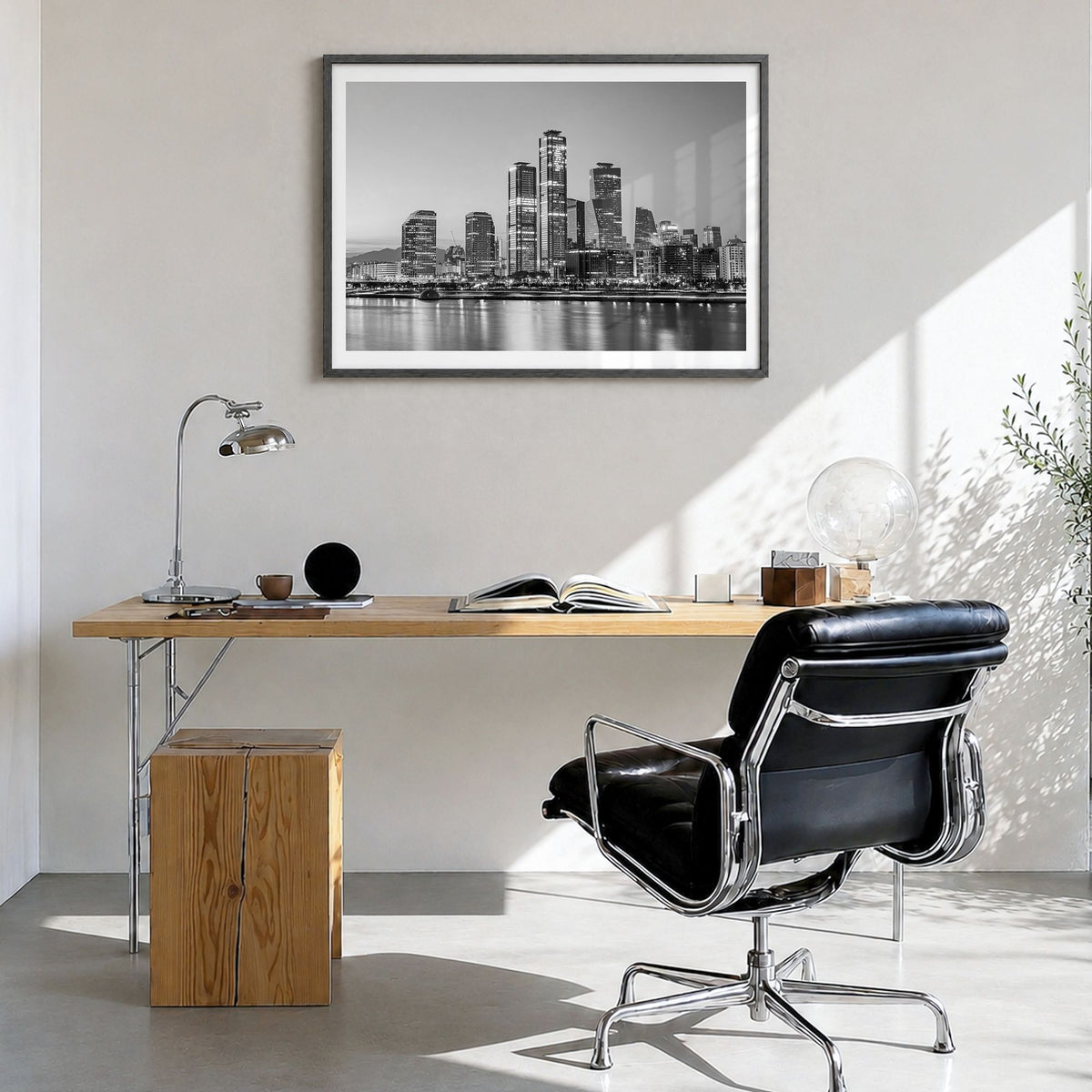 Seoul Photo Poster in a black wood frame, hanging in a bright home office, white border
