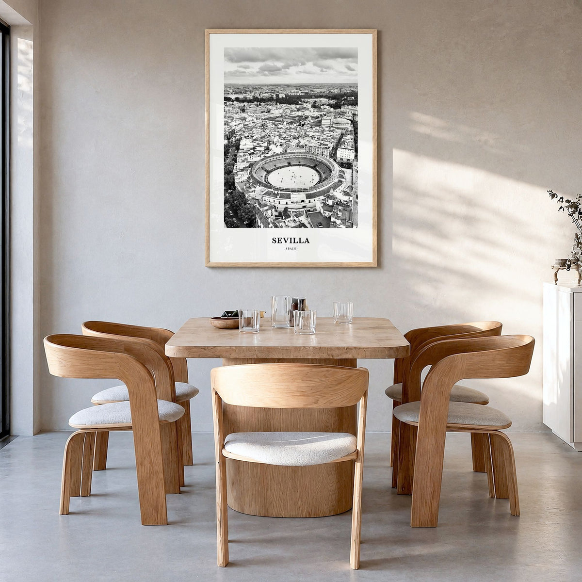 Sevilla Classic Poster in a natural wood frame, hanging in a dining room