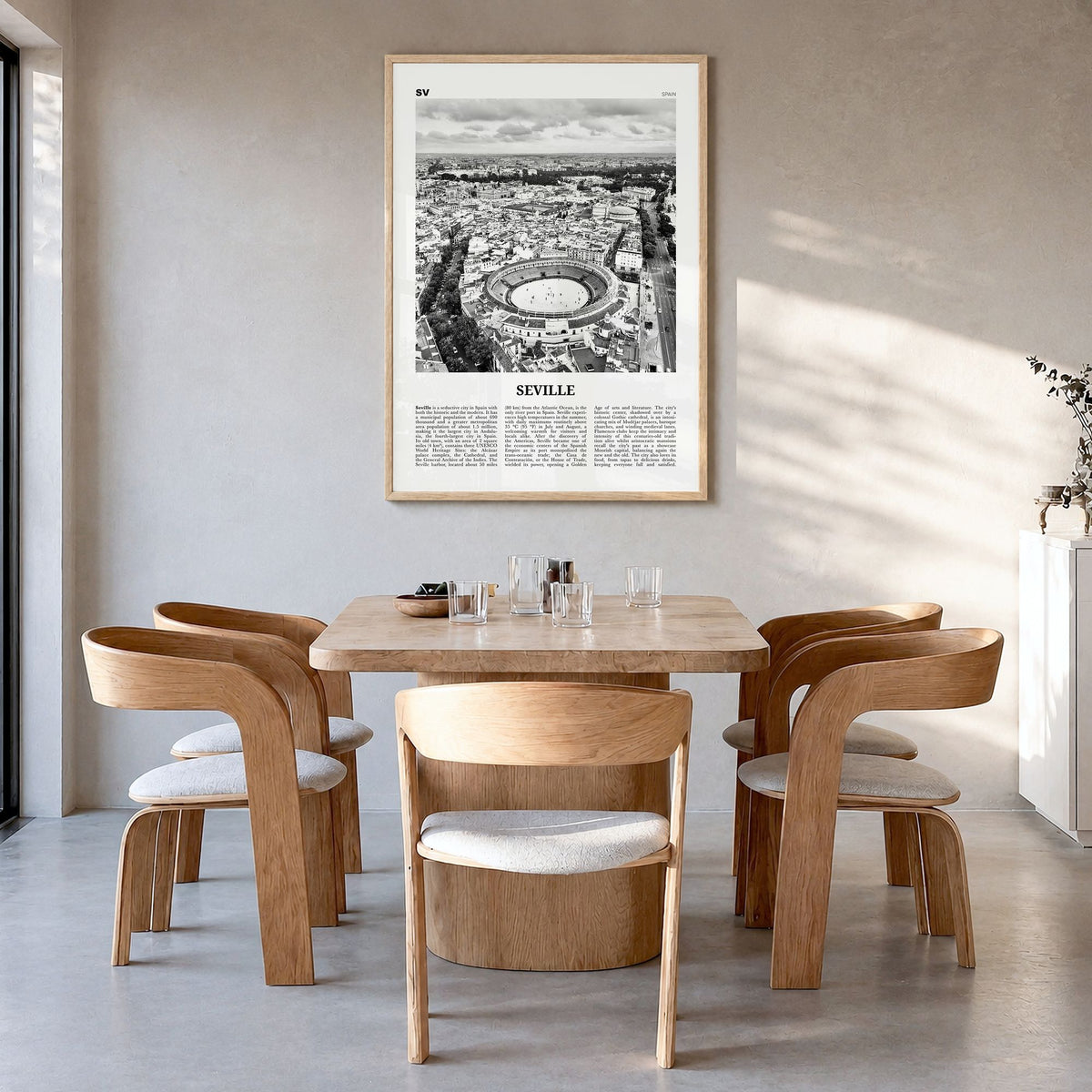 Seville Newspaper Poster in a natural wood frame, hanging in a dining room