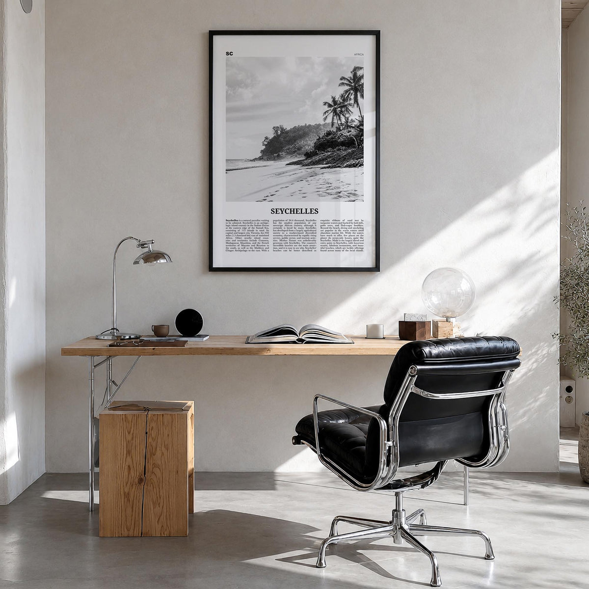 Seychelles black & white newspaper poster of Africa – vertical wall art in black wood frame, hanging on wall