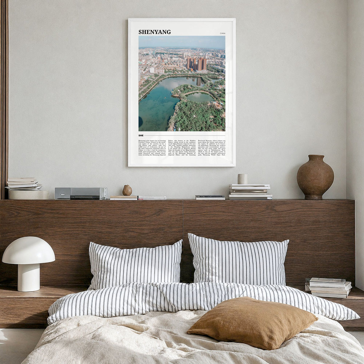 Shenyang Travel Poster in a white wood frame, hanging in a bedroom