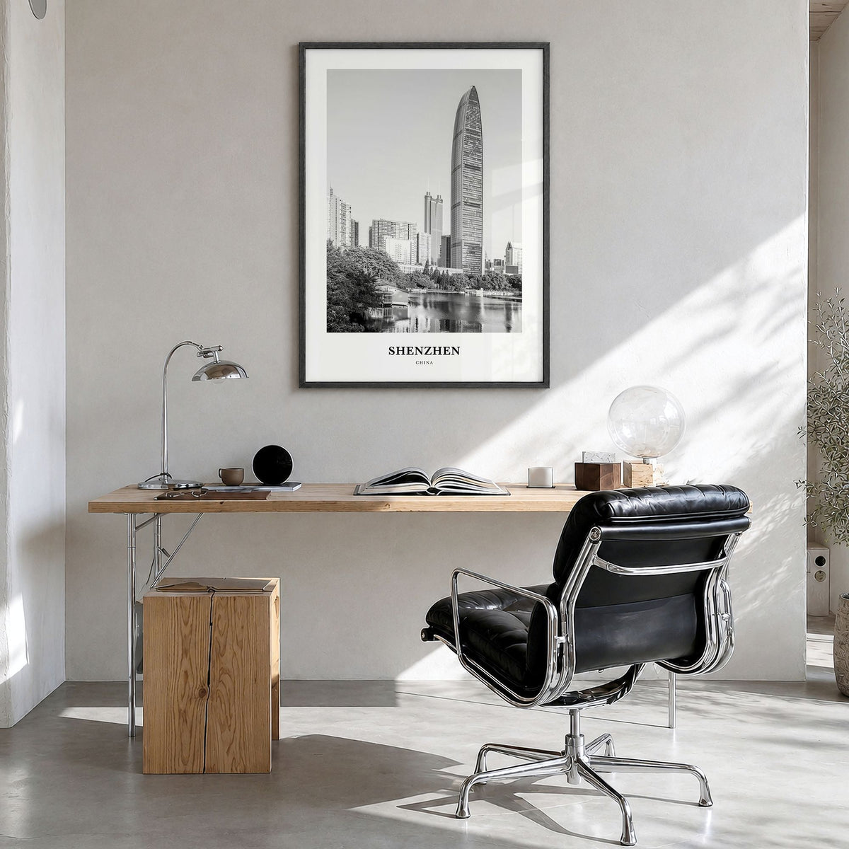 Shenzhen Classic Poster in a black wood frame, hanging in a bright home office