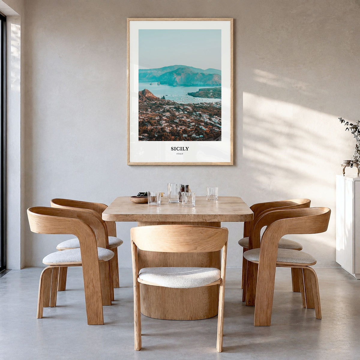 Sicily Classic Poster in a natural wood frame, hanging in a dining room