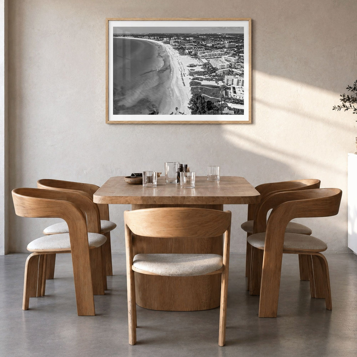 Siesta Key Photo Poster in a natural wood frame, hanging in a dining room, white border