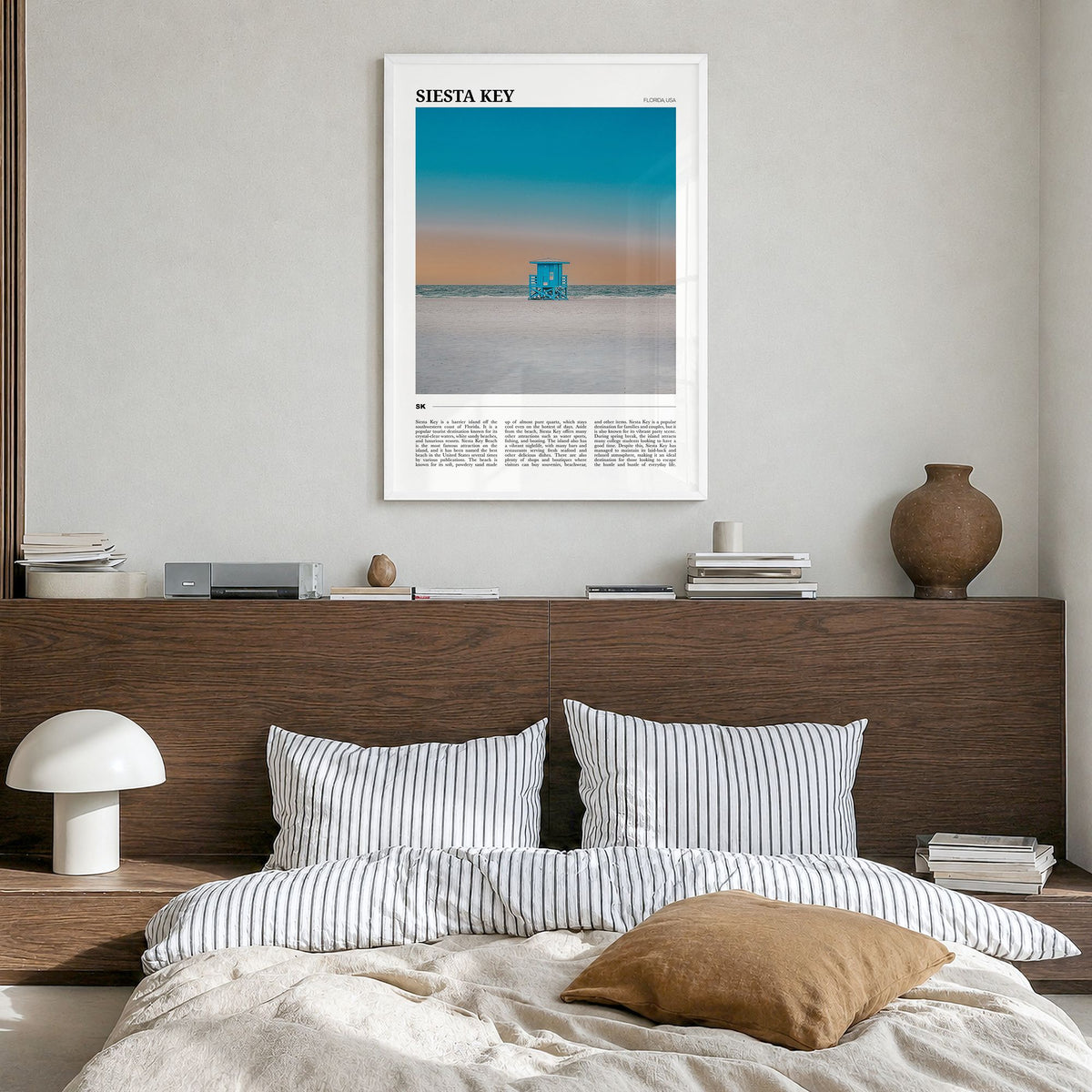 Siesta Key Travel Poster in a white wood frame, hanging in a bedroom
