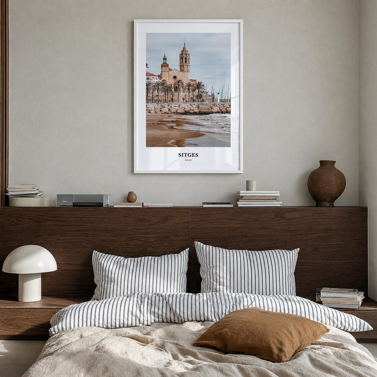 Sitges colorful classic poster of Spain – vertical wall art in white wood frame, hanging on wall