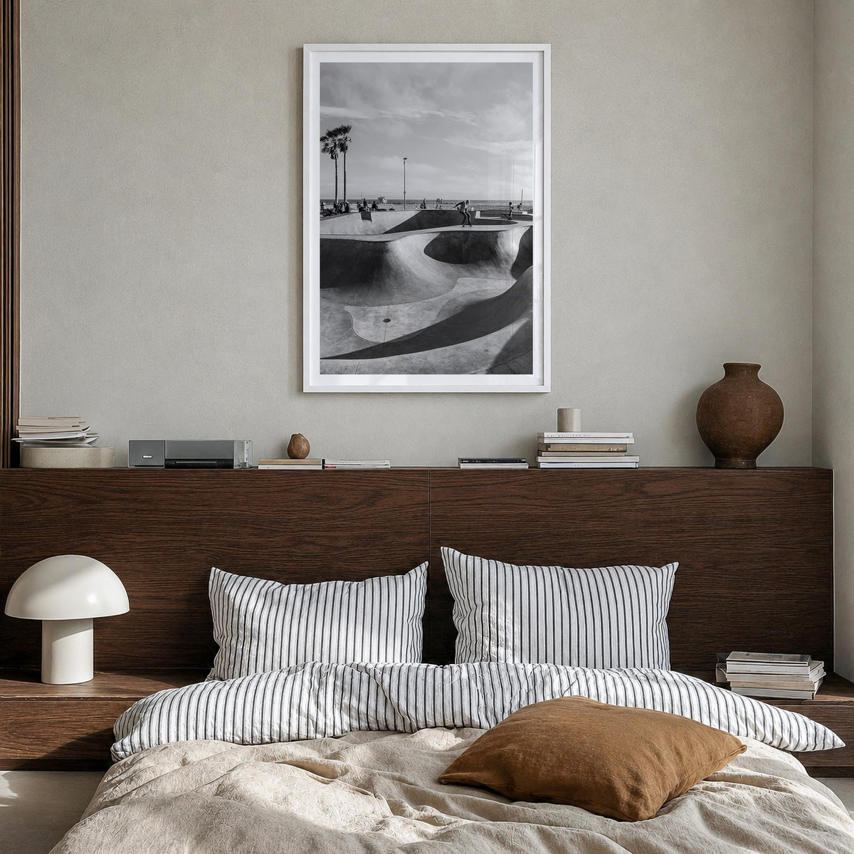Skateboard no. 2 black & white photo poster – vertical wall art in white wood frame with white border, hanging on wall