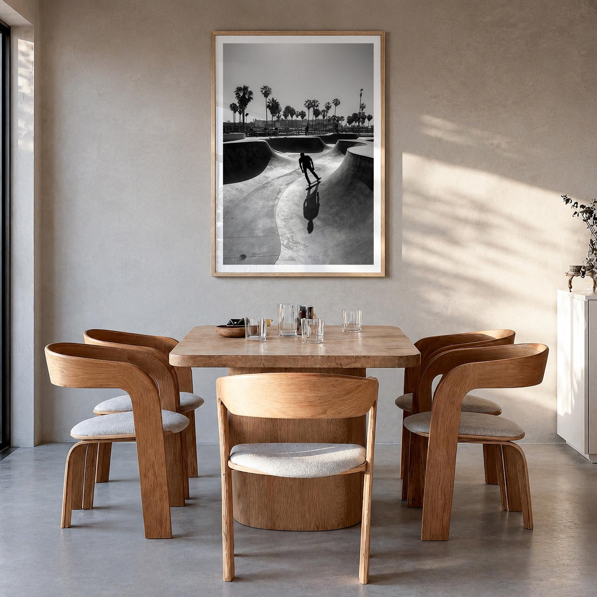 Skateboard no. 3 black & white photo poster – vertical wall art in natural wood frame with white border, hanging on wall