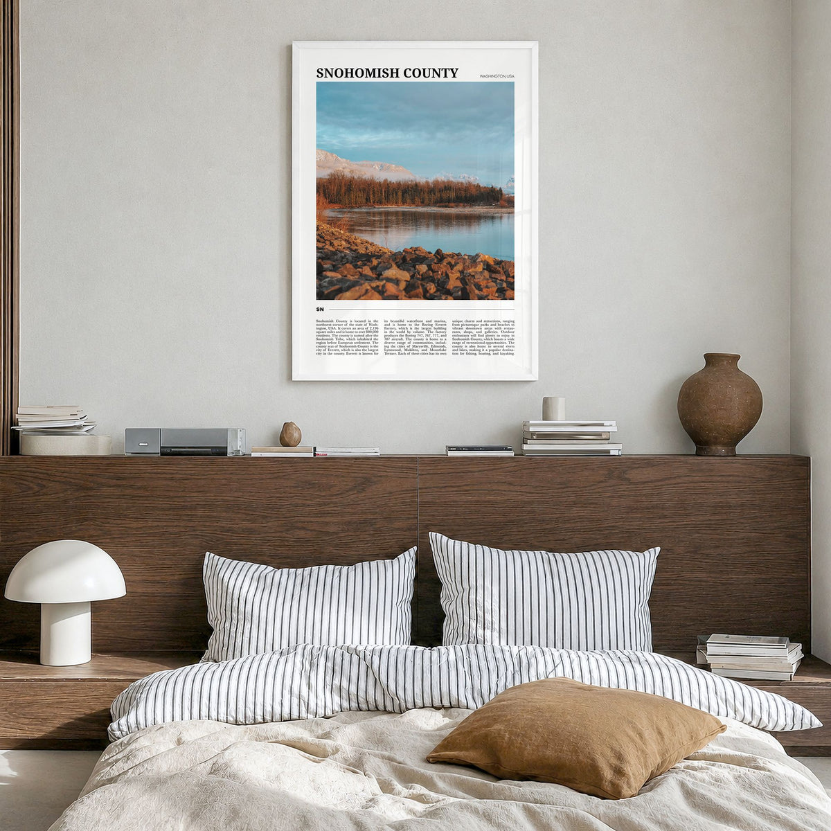 Snohomish County Travel Poster in a white wood frame, hanging in a bedroom