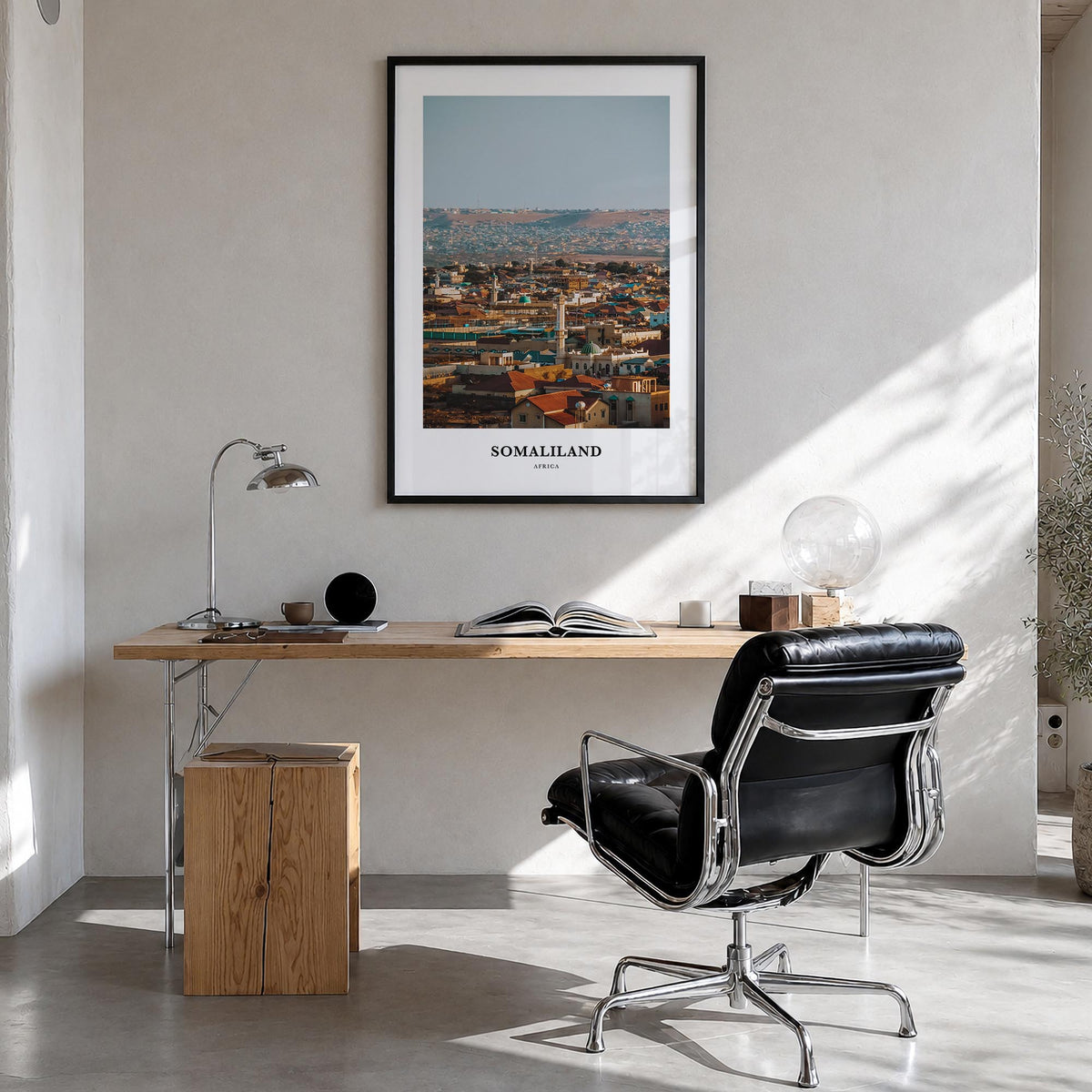 Somaliland colorful classic poster of Africa – vertical wall art in black wood frame, hanging on wall