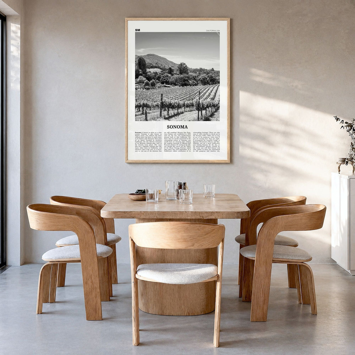 Sonoma Newspaper Poster in a natural wood frame, hanging in a dining room