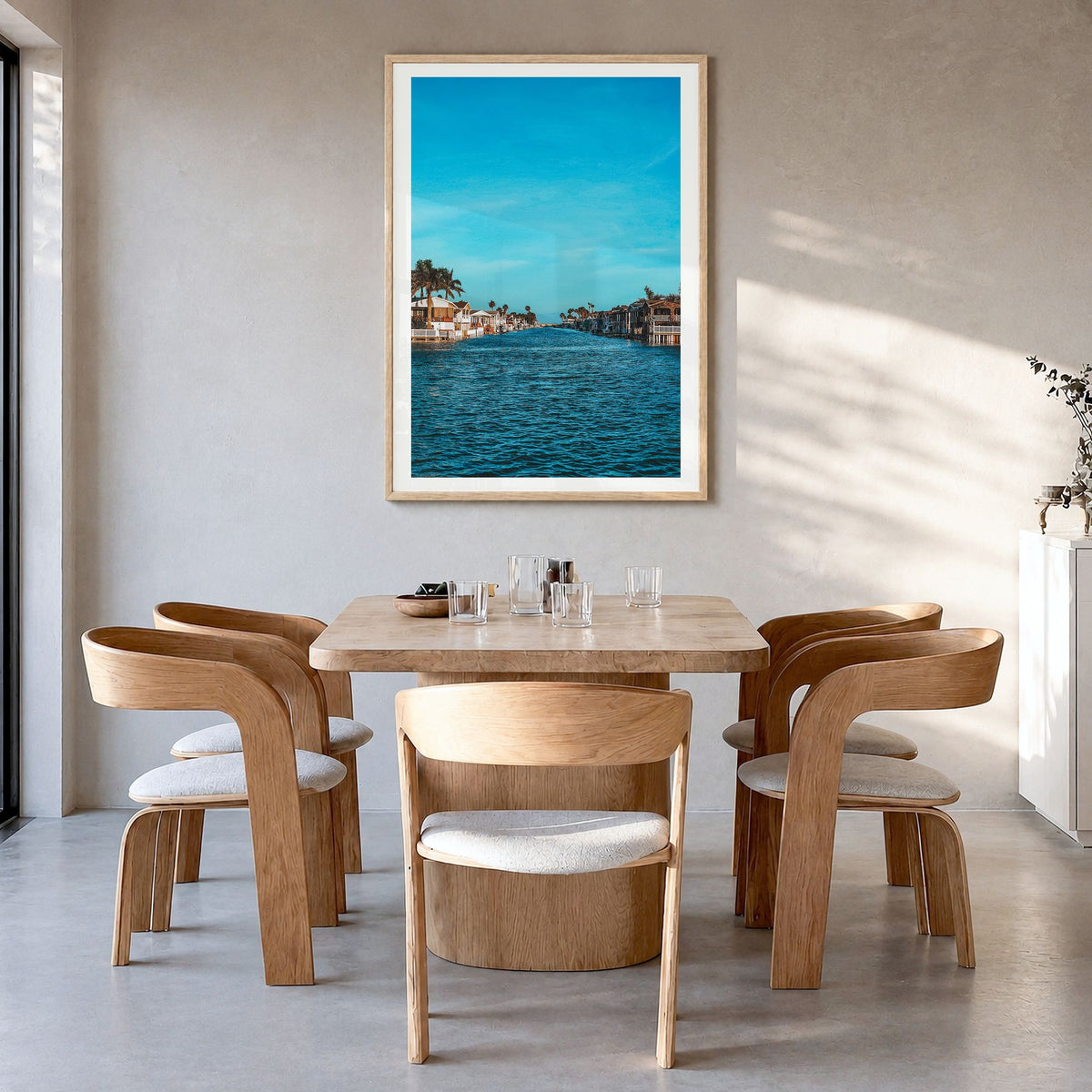 South Padre Island Photo Poster in a natural wood frame, hanging in a dining room, white border