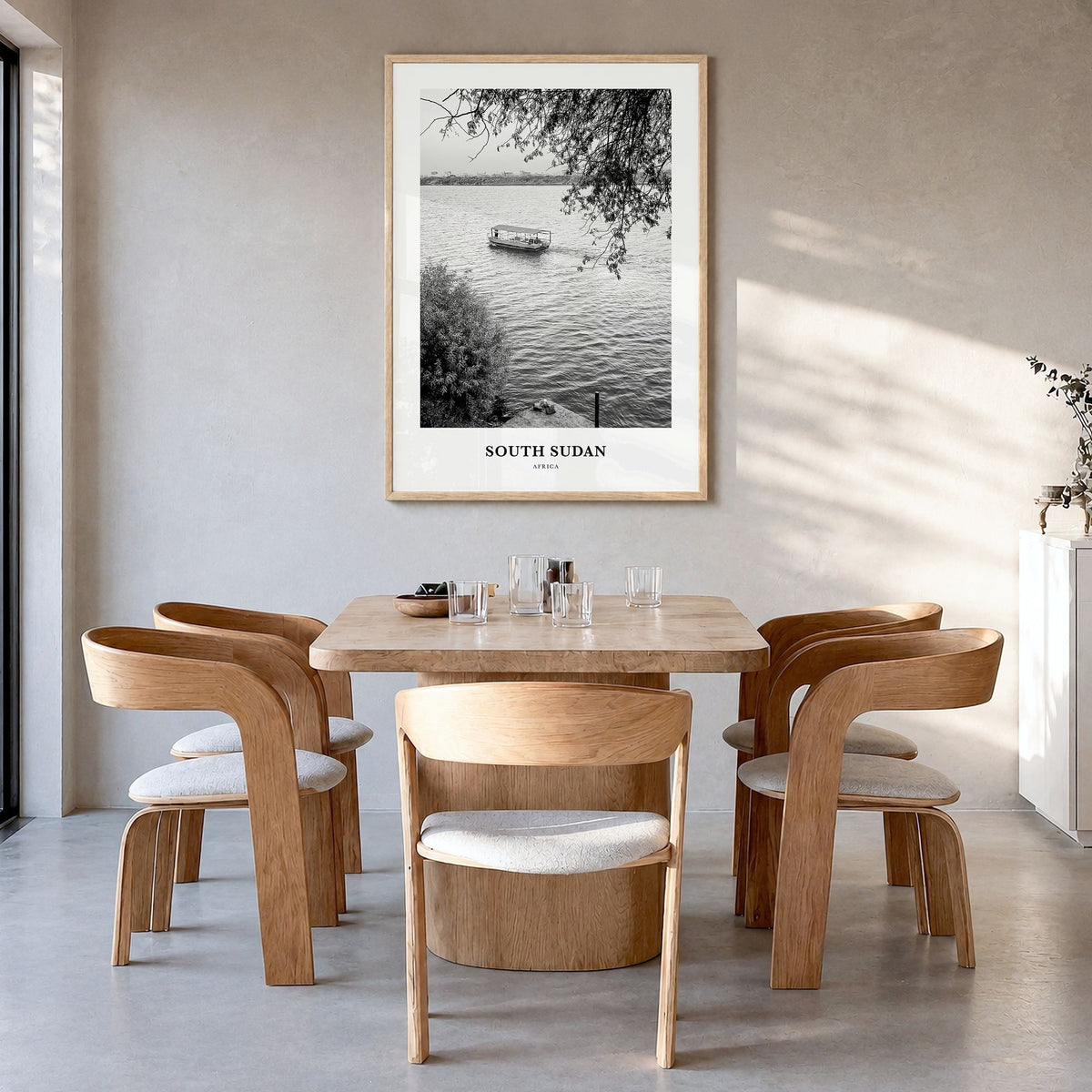 South Sudan Classic Poster in a natural wood frame, hanging in a dining room