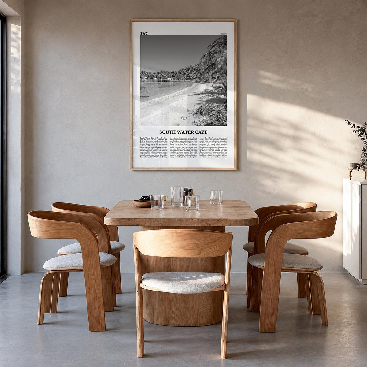 South Water Caye black & white newspaper poster of Belize – vertical wall art in natural wood frame, hanging on wall