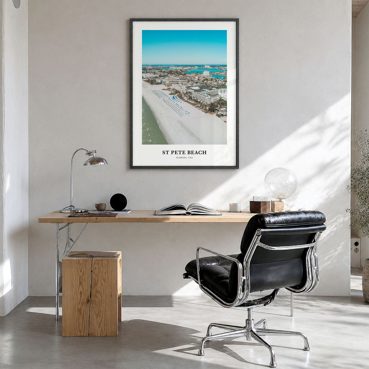 St. Pete Beach Classic Poster in a black wood frame, hanging in a bright home office